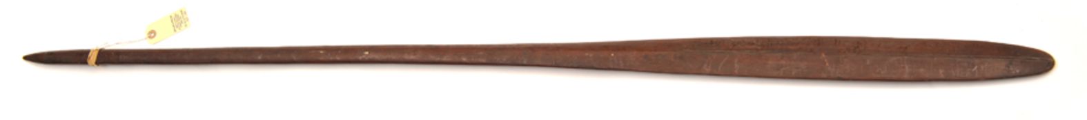 A Solomon Islands slender tapered hardwood “paddle” club, 56” overall, of elliptical section, the