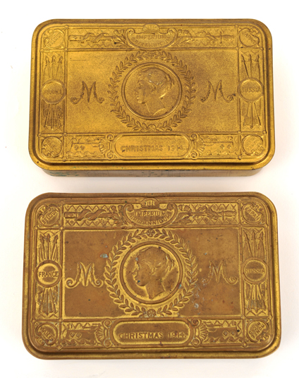 A Princess Mary’s 1914 gift tin, containing original packets of cigarettes (opened) and tobacco (