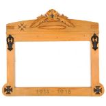 A German pine memorial frame, the top with relief representation of an airship and foliate spray