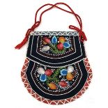 An attractive North American Iroquois Indian beadwork pouch, decorated with coloured flowers on a