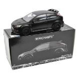 A Minichamps Ford Focus RS500 2010. In satin black with black interior. Boxed, loose one screw