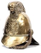 A fireman’s brass helmet, with front peak and large back peak, imitation narrow chain link headband,