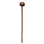 A Zulu knobkerry, flattened ball head, slender haft, lightly flared towards grip, 20½” overall. GC