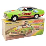 A 1970’s T.P.S. (Toplay) battery operated tinplate Ford Mustang ‘The Swinger’. Painted in lime green