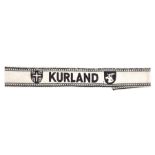 A scarce Third Reich Kurland cuff title, black machine woven on white background, instituted March