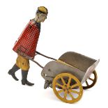 A tinplate ‘Woods Mechanical Toys’ clockwork toy. An American farmer style figure pushing a