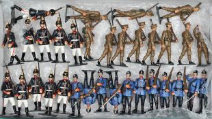 33 white metal soldiers. German WW1 infantry wearing pickelhaubes. In light blue tunics, dark blue