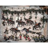 21 white metal soldiers. Comprising 5 mounted troopers and one Officer of the 11th Hussars. 2