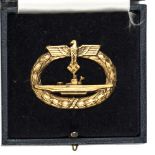 A Third Reich U Boat badge, hollow back, in case, gilt impressed U Boot Kriegsabzeichen. GC Plate