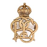 A cap badge of Paget’s Massage Service. GC          Plate 2