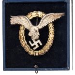 A Third Reich Luftwaffe pilot observer’s badge, of silvered and gilt finish, marked on reverse “C
