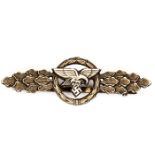 A Third Reich Luftwaffe Transport clasp, of pale gilt finish with WM metal eagle riveted on. GC