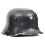 An Imperial German Model 1916 steel helmet, steel grey finish overall complete with its original
