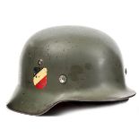 A Third Reich M35 pattern double decal steel army helmet,  skull rim stamped “4490” and “SE66”,