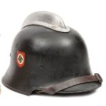 A Third Reich fireman’s double decal helmet issued to Police,  the smooth black painted skull with