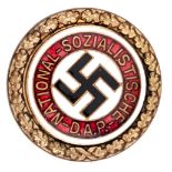 A very scarce Third Reich N.S.D.A.P. member’s badge in gold, numbered 1028 on reverse, marked “Ges
