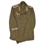 A fine Third Reich M43 Afrika Korps green denim tropical service tunic,  to an Unterfeldwebel of