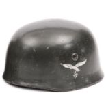 A Third Reich Luftwaffe parachutist’s helmet, the skull with ET maker’s  mark (Eisnhuttenwerke,