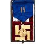 A scarce Third Reich SS long service award, first class, 25 years service, with its ribbon in its