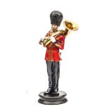 A Michael Sutty painted figure of a Sergeant bandsman of the Scots Guards,  in full dress playing