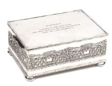A silver plated rectangular presentation casket, reeded edges, ornamental embossed sides,