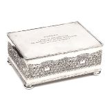 A silver plated rectangular presentation casket, reeded edges, ornamental embossed sides,