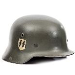 A Third Reich Waffen SS M35/40 pattern double decal steel helmet, field grey painted skull, rim