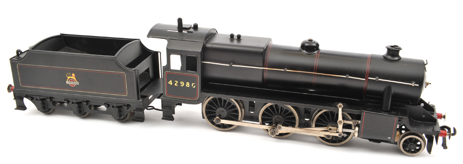 A Bassett-Lowke live steam O gauge 2-6-0 locomotive and tender. In BR red lined black livery, RN