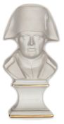 A French parian ware bust of Napoleon, wearing bicorne hat, on integral glazed gilt lined pedestal