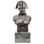 A large bronze head and shoulders bust of Napoleon, wearing bicorne hat and plain greatcoat,