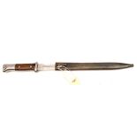 A German 1884/98 Third Model bayonet with saw back blade, the blade reduced to 9½” and repointed, by