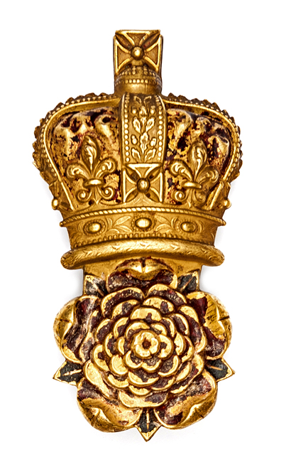 A Georgian Grenadier Guards officer’s gilt bearskin badge, crowned rose, with long wire loop