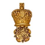 A Georgian Grenadier Guards officer’s gilt bearskin badge, crowned rose, with long wire loop