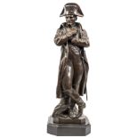 A well modelled bronze figure of Napoleon, resting against a tree stump, wearing bicorne hat,