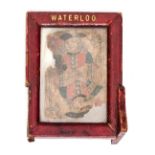 A waterloo relic being a playing card, the Knave of Hearts, in a small standing leather frame