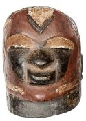 A mid 20th century Makonde hollow carved wood full head mask from Tanzania, with non pierced
