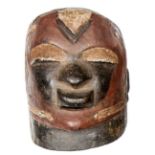 A mid 20th century Makonde hollow carved wood full head mask from Tanzania, with non pierced