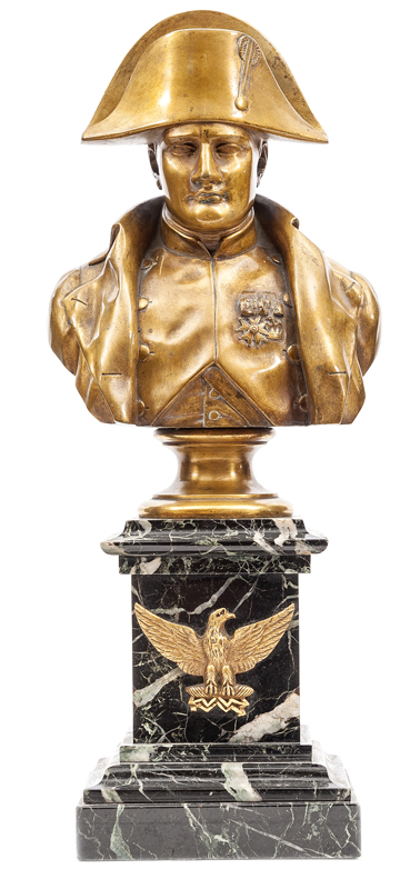 A brass head and shoulders bust of Napoleon, wearing bicorne hat and coat, medals to chest, on a