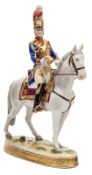A painted porcelain mounted figure of a French “Trompeter 1814/15”, in full dress, with trumpet