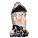 A Staffordshire polychrome lidded jar in the form of a bust of Wellington, wearing blue coat and