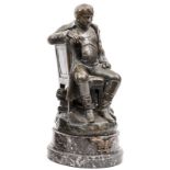 A bronze figure of Napoleon, seated sideways on a chair, wearing greatcoat without headdress, signed
