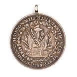 A small silver medal “To The South Devon Militia in Testimony of Merit 1799”, obverse: trophy of