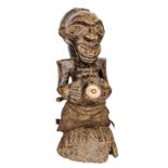 An early 20th century Songey carved wood fetish figure from the Congo, in the form of an old man