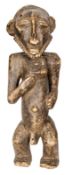 An early 20th century Hembe carved wood standing male figure from the Congo, height 21”. GC (some