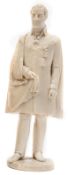 A nicely carved ivory standing figure of Wellington, wearing a knee length cloak, integral round