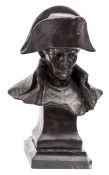 A bronzed bust of Napoleon, with high collar and bicorne hat on integral plinth, signed on the