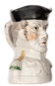 A Toby jug in the form of the head and shoulders, Duke of Wellington, black headdress, height 7”.