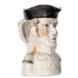 A Toby jug in the form of the head and shoulders, Duke of Wellington, black headdress, height 7”.