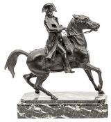 A bronze figure of Napoleon, reining in his charger Marengo, wearing bicorne hat and cloak,