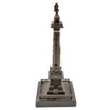 A bronze model of a column based on Trajan’s column in Rome, surmounted by a figure of Napoleon,